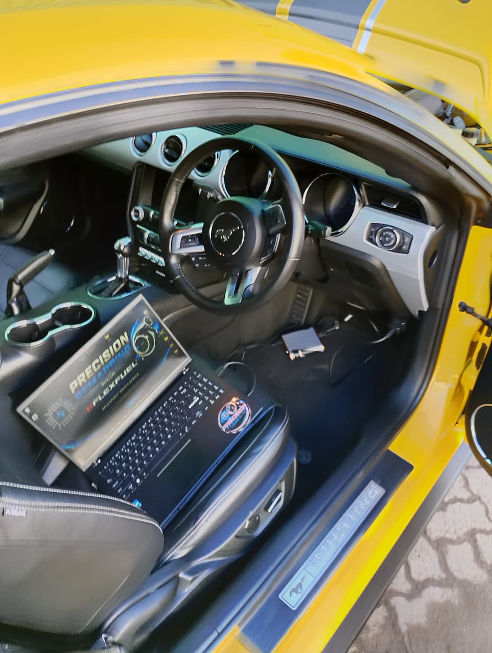 Tuning laptop connected to a Mustang during a live ECU session