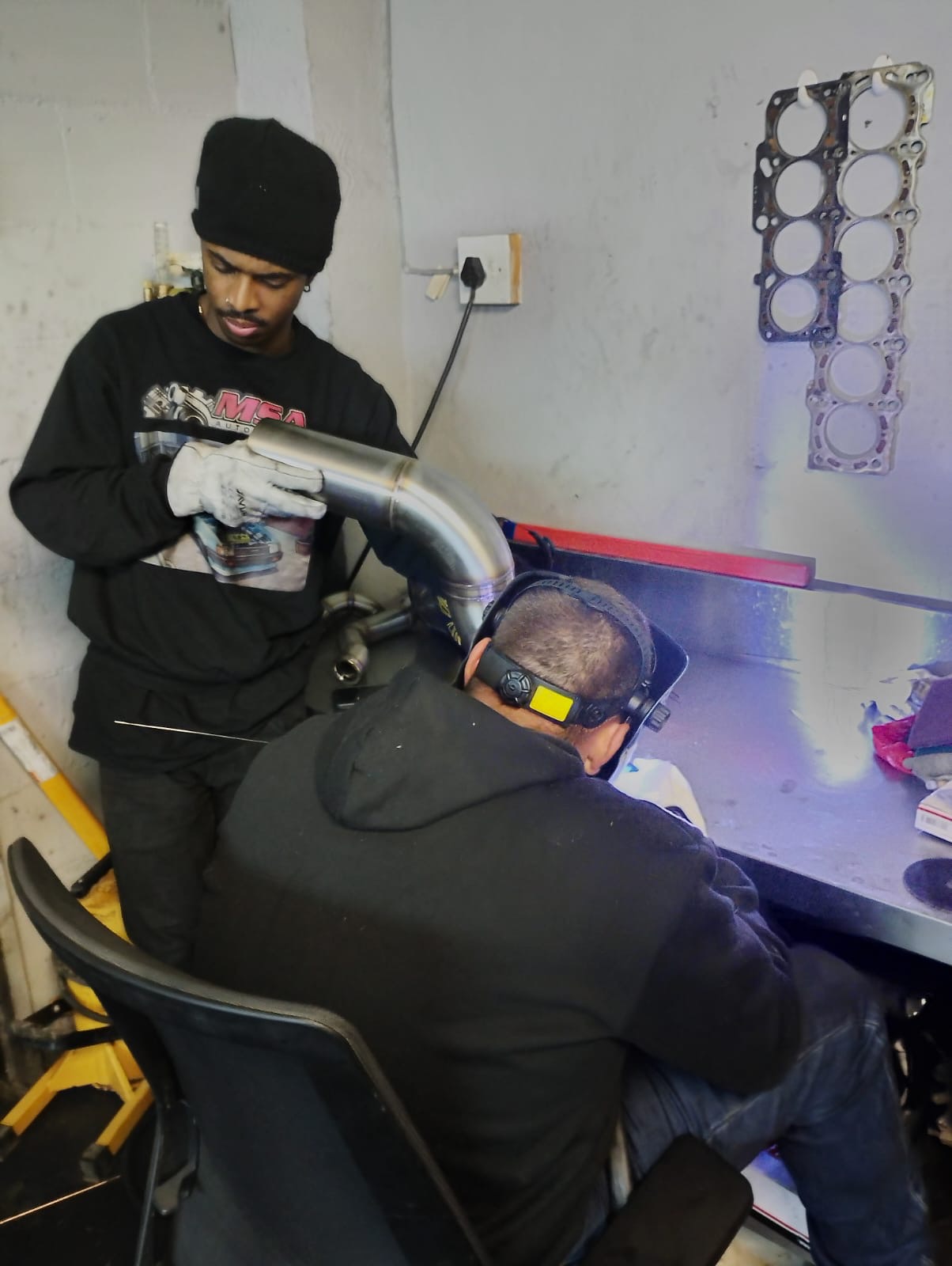 Custom stainless steel performance exhaust fabrication in the workshop